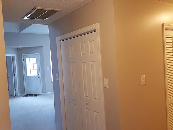 View from foyer, glass door opens to patio.