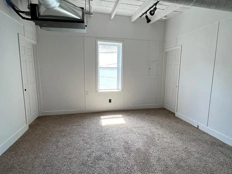 living room with bedroom 1 on left and bedroom 2 on right
