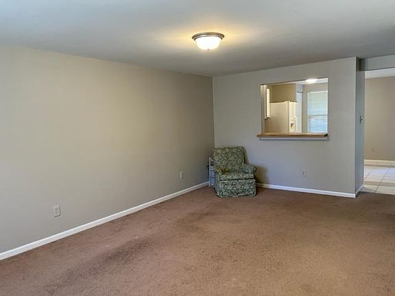 Living Area With Serving Window from kitchen
