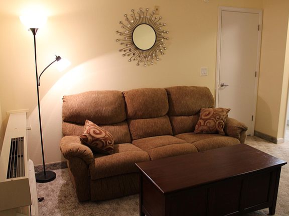 Living area. Large TV faces the sofa.
