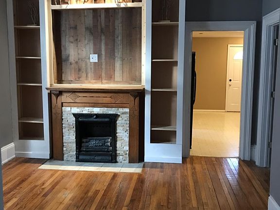 Fireplace with built-in bookshelves