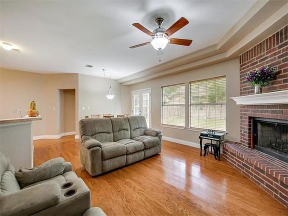 Gleaming wood floors! Wood or tile, no carpet. Good for pets, kids and allergies. Large windows and french doors let the light stream in.
