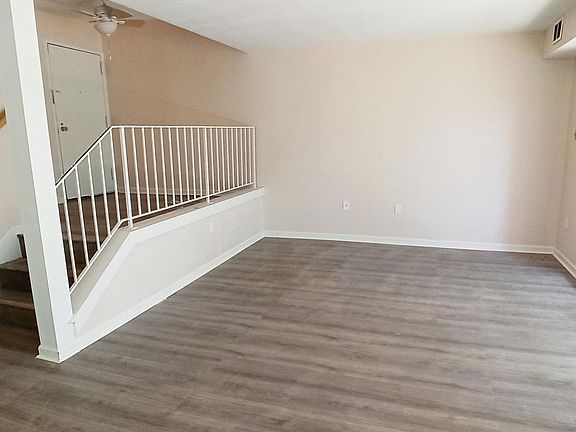 Grand entrance and spacious living room that measures 12 ft. x 12 ft.