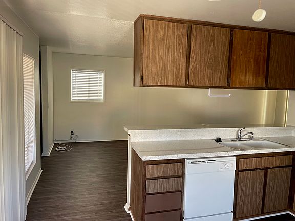 Kitchen w/dishwasher and sink. 
Patio 1 is to the left