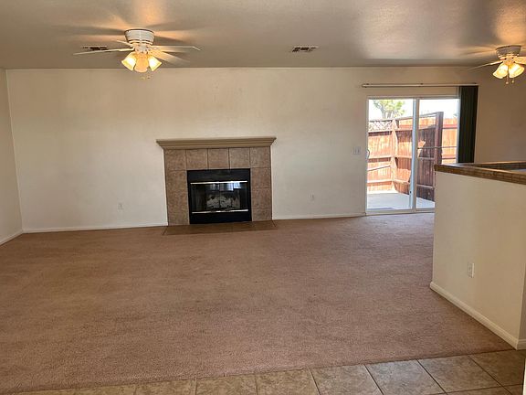 Wood burning fireplace and exit to patio