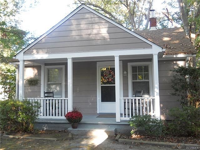 Charming country front porch with rocking chairs