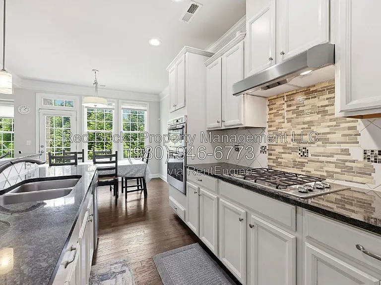 9659 Camberley Ave NW — Photo 15