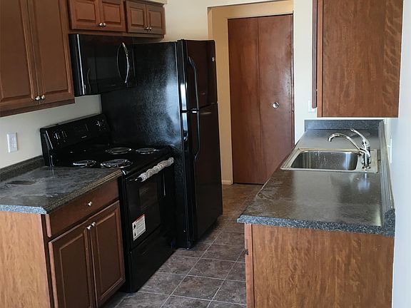 Large windows with new blinds in the living room.