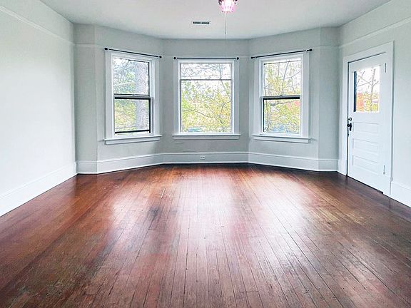 Living room with bay windows
