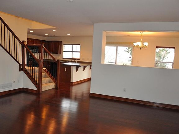 Living Room looking into kitchen and dining room.