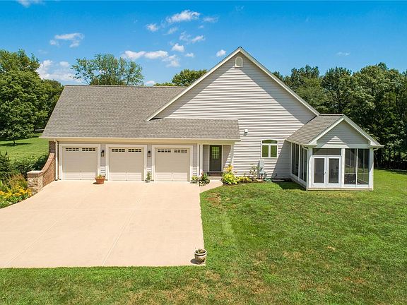 3 car insulated and finished garage w/ over-sized 8x8 doors.