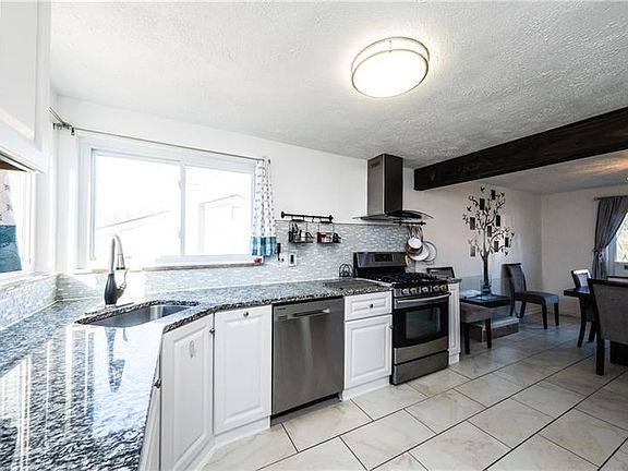 White Miist Granite Counters less than 3 years old.