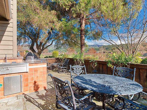 The patio features an outdoor Kitchen and fabulous views bey