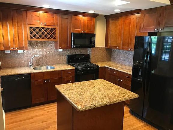 Nice kitchen with granite, newer appliances and beautiful cherry cabinets!