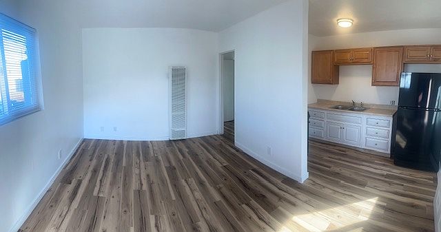 Open living room and kitchen area. Corner unit at rear for extra privacy.