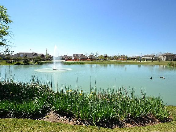 Lake with fountain located behind