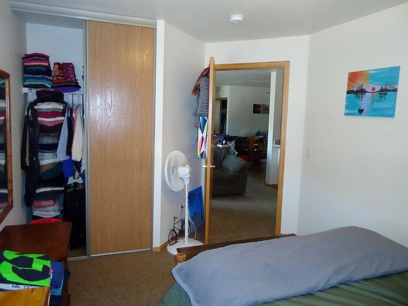 Bedroom, closet, looking out at living and dining room