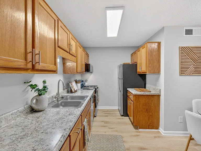 Spacious kitchen with generous counter space and dining area in Murfreesboro apartment