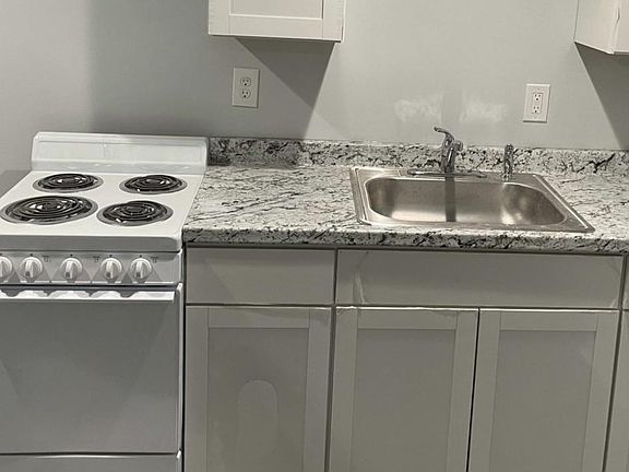 Stove and Sink/Kitchen Cabinets
