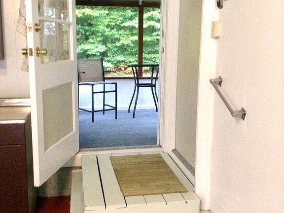 Freshly updated semi private screened porch. Furniture included.