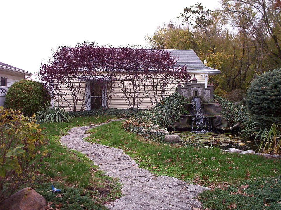 garage and pond from the bbq/patio area