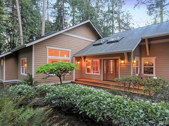 Beautiful landscaping enhances this 1.7 acre property nestled privately on the lot.  