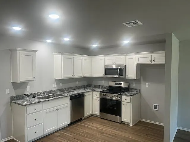 Kitchen with granite countertops and stainless steel appliances