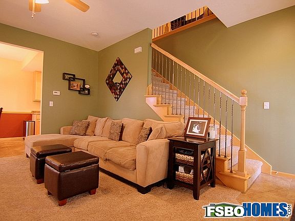 Staircase to Upper Level Featuring Iron Spindles