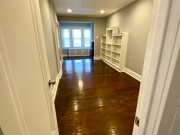 Massive Primary Bedroom with Sitting Area, Shelving, and Spacious Closets