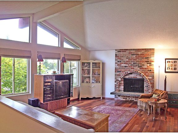 Upstairs family room. Wood burning brick fireplace. Real hardwoods new 2006.  