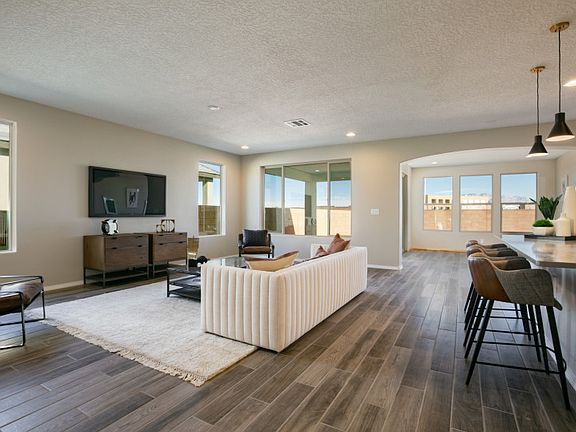 The Tifton Walk features an open floor plan that seamlessly connects the gathering room, living room