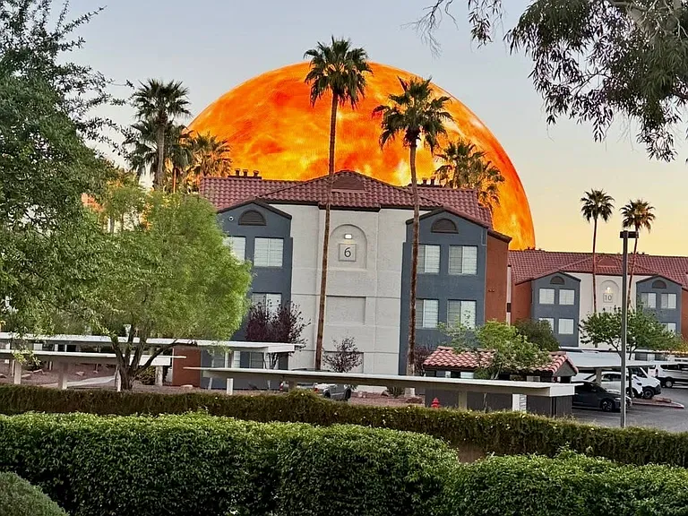 View of the Las Vegas Sphere visible just outside the building, offering a glimpse of the city's most iconic landmarks.