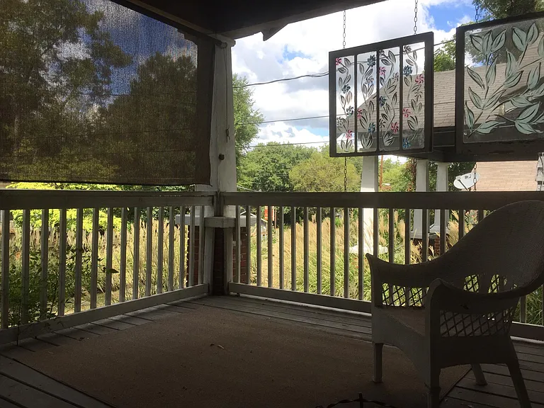 Front porch over looking front yard and Maple Street