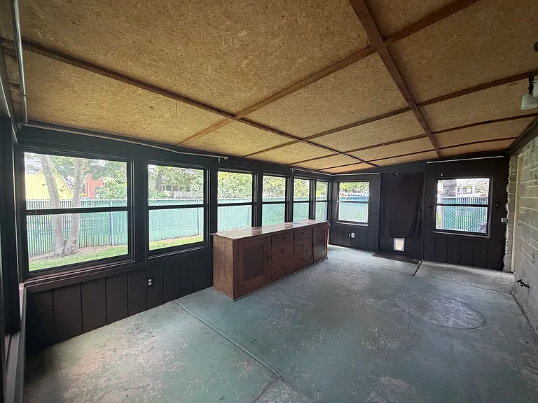 Enclosed patio with access off extra room and laundry room.
