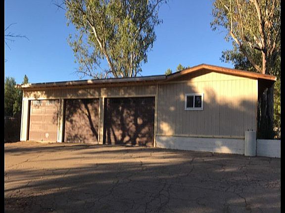 Detached 3-car garage w/ large workshop, can also be converted and/or rented.