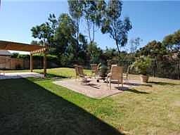 Large park-like backyard at top of canyon