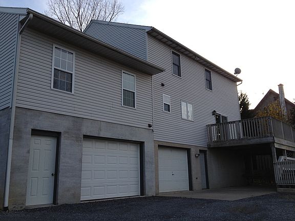 Rear 2 Car Garage & Deck & Patio
