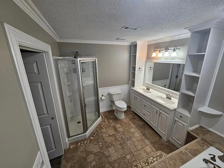 Master with separate stand-up shower and dual vanities