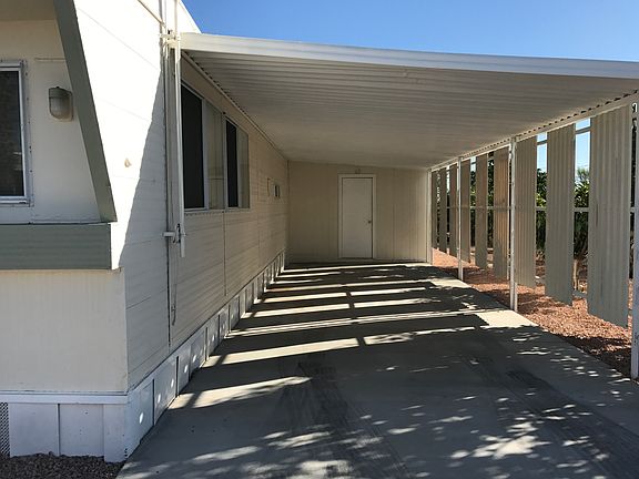 COVERED, CONCRETE DRIVEWAY