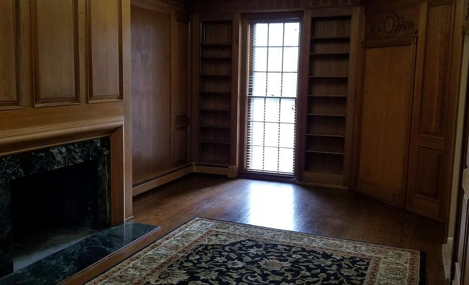 Living Room (12x12) with wood floors, ornamental fireplace a