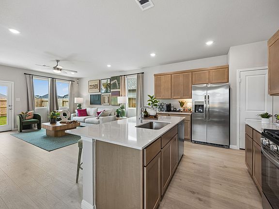 Kitchen in the Oak home plan by Trophy Signature Homes - REPRESENTATIVE PHOTO