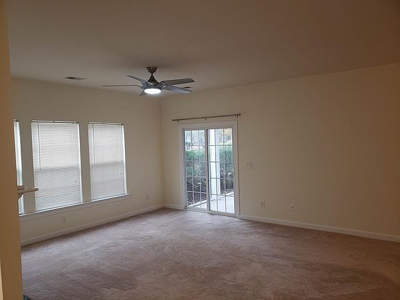 Large and open living space that leads to fully screened in cozy patio