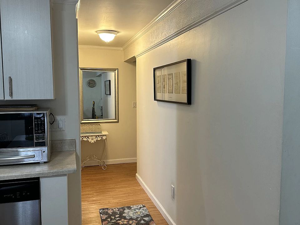 Hallway from kitchen to bedroom at the end of the hallway.