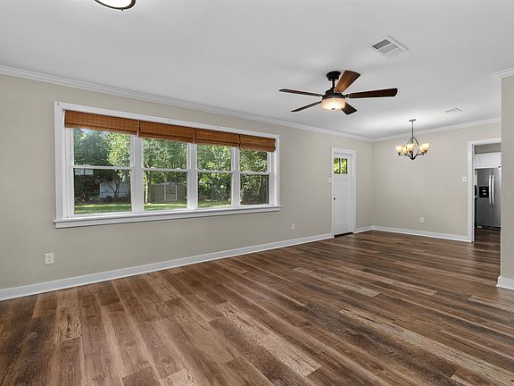 Large Open Living space with natural light and access to the rear yard