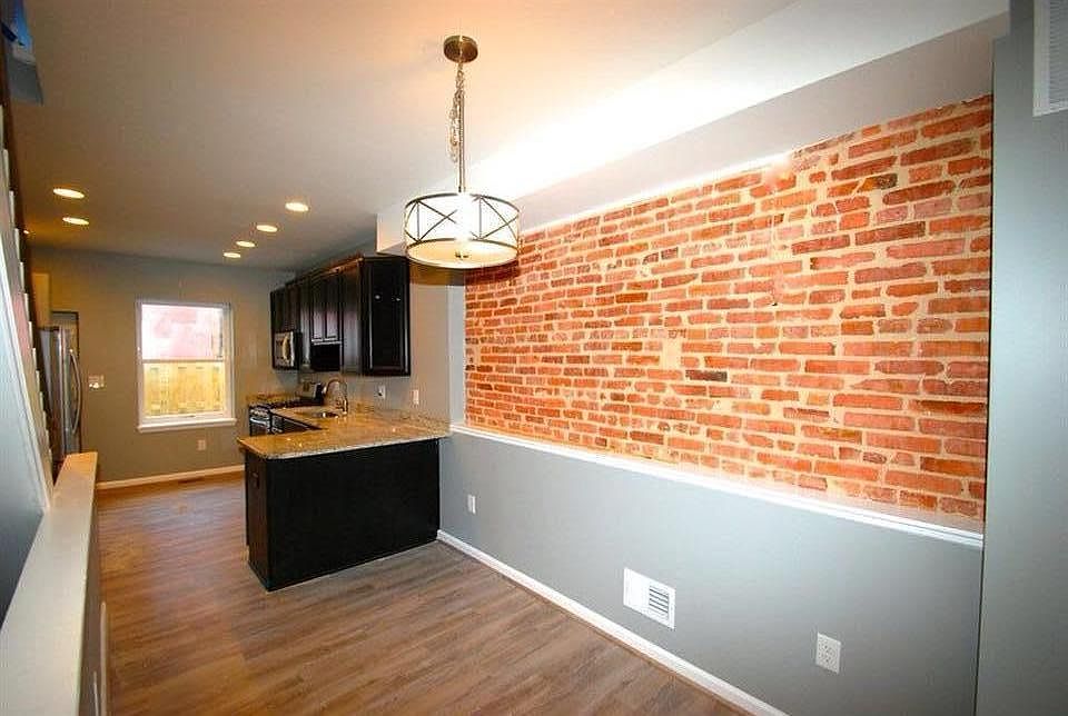 Exposed brick in the dining area gives a classic Baltimore l