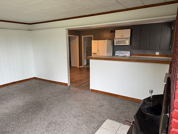 Living room with view of kitchen.