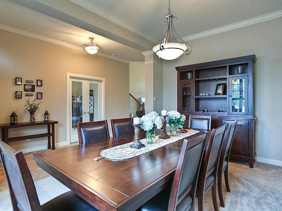The dining room will accommodate a large table. Notice the crown molding.