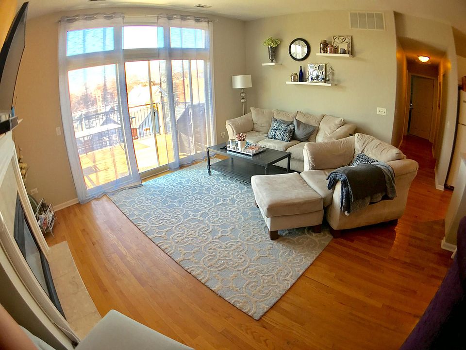 Living room, hardwood floor, fireplace, private balcony off of living room.