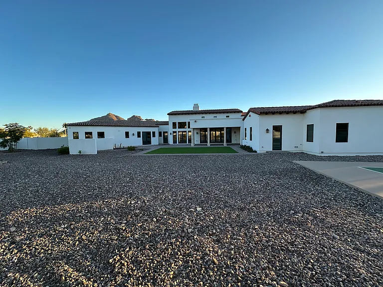 home viewed from private, fully-fenced backyard