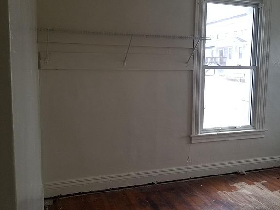 Bdrm#1 doesn't have a closet, but the rack hanging here.